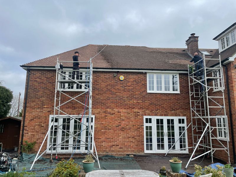 Roof cleaning carried out safely from scaffold towers by The Roof Moss Cleaners in Carterton
